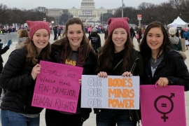 Picture of young women standing with signs in Washington D.C.